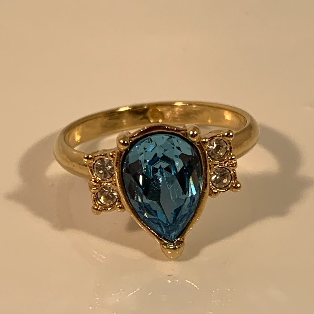 Faux Topaz and diamond Ring set in Gold Tone Setting